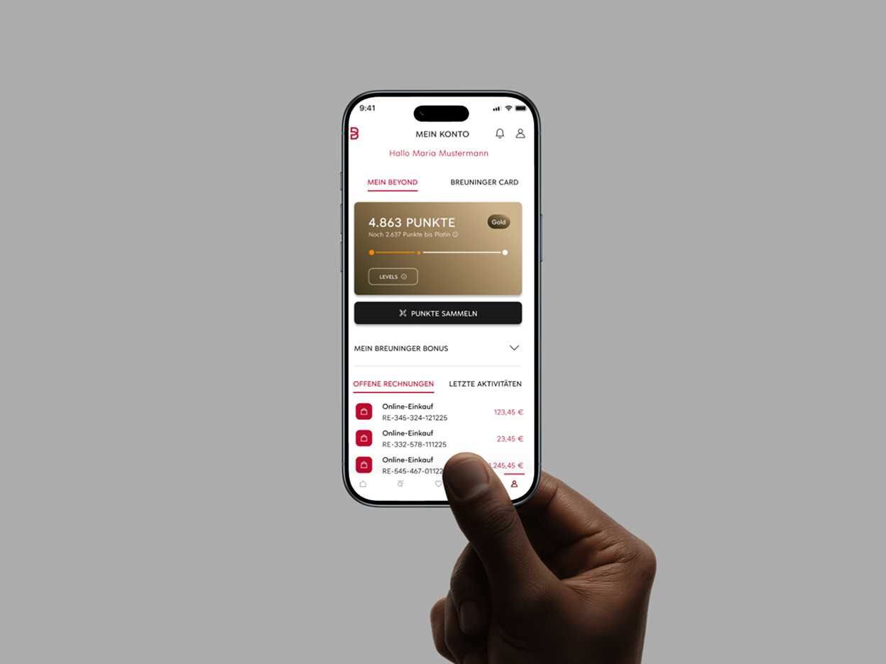 Smartphone-Mockup der Breuninger App: Kontoübersicht mit Beyond-Punktestand und offenen Rechnungen